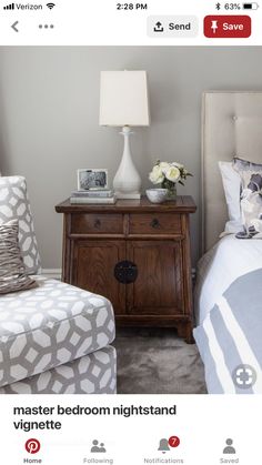 a bedroom with two chairs and a nightstand