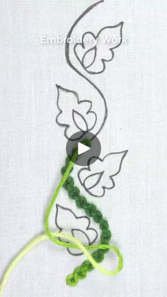 a video demonstrating how to make an embroidered flower with beads and thread on the side