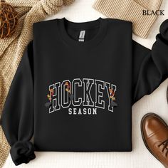 Get ready for the rink with this "Hockey Season" Gildan crewneck sweatshirt, featuring bold arched college block lettering. Perfect for hockey moms, dads, and fans alike, this cozy sweater is a must-have for game days or cheering from the stands or just showing off your love for all things Hockey! Great couples matching sweatshirts!  Sizing: These sweatshirts fit somewhat loose, and are generally true to size. For an oversized fit, select two or three sizes up. For measurement details, see size Hockey Sweat Pants, Hockey Mom Sweater, Hockey Crewneck, Hockey Sweatshirts Hoodie, Hockey Hoodie, Hockey Season, Matching Sweatshirts, Hockey Mom, Block Lettering