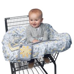 a baby is sitting in a shopping cart