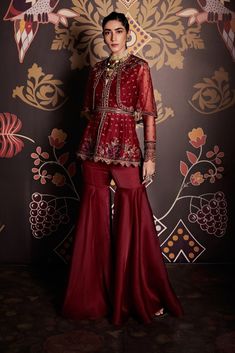 Editor's Note Embroidered Net Cape Peplum And Organza Gharara Paired With Belt Fabric: Peplum: Net, Gharara: Organza Color: Burgundy Care: Dry Clean Only  About the Designer                    ... Organza Gharara, Net Sharara, Organza Sharara, Gharara Designs, Ridhi Mehra, Raw Silk Lehenga, Anarkali Lehenga, Net Blouses, Embroidered Crop Tops