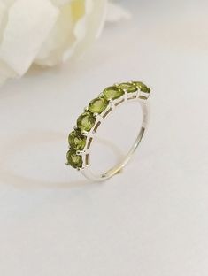 Material :- Silver Gemstone:- Natural Green Peridot Item Weight :- Approx. 2.50 Grams Stone treatment :- 100% Natural Stone Size :- 4 MM Stone Shape :- Round Cut ( 7 Stone ) Metal :- 925 Solid Sterling Silver Purity :- 925 Select Size in Variation , if you don't find perfect size please buy any size and message us your size we'll make Payment Policy We accept payment through PayPal. All payments must be made within 7 days of purchase. If you are experiencing some difficulty in paying through Pay Tennis Ring, Aquamarine Stacking Ring, Peridot Birthstone Ring, August Birthstone Ring, Peridot Birthstone, Aquamarine Birthstone, Green Gemstone Ring, Sterling Silver Jewelry Handmade, Peridot Ring