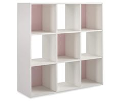 a white bookcase with four different sections