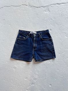 Vintage 90s Express Bleus jeans that have been made into shorts. High rise, dark wash. Made in USA.   Brand:  Express Bleus 100% Cotton Marked size 9/10 Measurements: Waist:  30" (doubled) Hips:  41.5" (doubled) Inseam:  3.5" Rise:  11" Thigh Opening Circumference:  21.5" PLEASE CHECK MEASUREMENTS. Returns are not accepted. Let me know if you have any questions about the measurements or how I measure. I am happy to help. All items are sold as is. I do my best to note any significant flaws. Keep in mind that everything is vintage and pre-loved. There will be flaws due to the age and previous lives of these items. Returns are not accepted, so if you have any questions or concerns about the condition of an item please feel free to reach out. I am always happy to help! Vintage Dark Wash Straight Leg Shorts, Vintage Straight Leg Dark Wash Shorts, 90s Style Dark Wash Jean Shorts, 90s Dark Wash Denim Shorts, 90s Style Dark Wash Short Length Jeans, 90s Style Dark Wash Short Jeans, 90s High Rise Dark Wash Jean Shorts, 90s Style High Rise Dark Wash Jean Shorts, 90s Style Dark Wash Short Length Bottoms