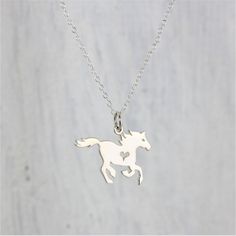 "Sterling Silver Horse Charm necklace. This adorable equestrian charm is a great way to show your love for horseback riding and horses! Due to its natural companionship with humans, the horse easily wins a special place in our hearts, earning high marks for honor and grace. Horses have come to stand for power, beauty, strength, freedom, and nobility. This charm would make a great gift for the lil' Cowboy or Cowgirl in your life, 4-H members, and Equestrian Fans! It's definitely \"Best in Show! » Racing Gifts, Lover Girl, Running Horse, Equestrian Gifts, Horse Necklace, Silver Horse, Horse Jewelry, Running Horses, Gifts For Horse Lovers