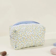 Introducing the MAIA Makeup Pouch, a beautifully crafted carry-all designed to be as versatile as it is stylish. With its delicate pastel watercolor flower print, pink gingham inner lining, and cozy quilted exterior, this pouch is the perfect size for all your essentials. Whether you're organizing cosmetics, skincare, haircare tools, accessories, or even packing for the beach, MAIA is up for the task. Soft, charming, and durable, she's your new go-to for everyday adventures. Toss her in your bag Spring Cosmetic Bag With Removable Pouch For Daily Use, Spring Cosmetic Bag For Daily Use, Spring Cosmetic Pouch For Daily Use, Rectangular Cosmetic Bag For Everyday Spring Use, Rectangular Everyday Cosmetic Bag For Spring, Everyday Rectangular Cosmetic Bag For Spring, Organizing Cosmetics, Quilted Cosmetic Bag, Quilted Makeup Bag