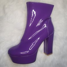 Step into the spotlight with our Purple Platform Ankle Boots: a groovy blend of retro chic and modern glamour! Stand out in style with the vibrant purple hue. Embrace your inner disco diva with these 70's-inspired boots and step into the magic today! Retro aesthetic design with a modern twist Glossy patent finish for added glam Bold platform sole for comfort and stability Vibrant purple hue to make a statement Trendy Purple Heels For Party, Purple Round Toe Platform Boots For Winter, Bold Winter Platform Boots, Fall Purple Platform Boots, Trendy Purple Platform Boots, Purple Ankle Boots For Spring, Trendy Purple Heels For Night Out, Purple Platform Boots For Fall, Bold Heeled Boots For Fall Party