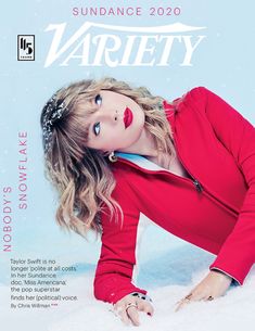 the cover of vanity magazine features a beautiful woman in red and white clothes on snow covered ground