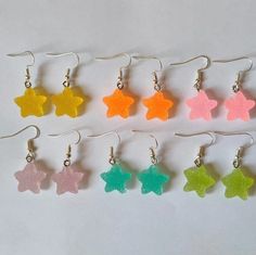 Resin sugar star earrings with hypoallergenic hook closure 🍬⭐. Measurements: 2.1 cm high x 1.8 cm wide. Star-shaped Party Earrings With Ear Wire, Star Shaped Earrings With Ear Wire For Party, Cute Star Charm Dangle Earrings, Cute Dangle Earrings With Star Charm, Star-shaped Earrings With Lever Back For Gifts, Trendy Star Embellished Jewelry Gift, Trendy Star-embellished Jewelry Gift, Trendy Star Embellished Jewelry For Gifts, White Star-shaped Earrings With Star Charm