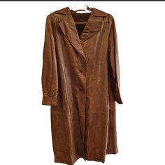 Stand Out From The Crowd With This Beautiful Womens Valentino Pelle Leather Coat, In Approximately Xl Size. The Rich Brown Color And Solid Pattern Make It A Timeless Piece. All Buttons Still Attached, Secret Zipper Compartment Inside Left Lapel. Some Fading/Wear On Leather On Back Of Coat From Long Period Of Storage. The Wool Lining Provides Added Warmth And Comfort. Elegant Brown Leather Jacket With Pockets, Elegant Brown Leather Long Coat, Elegant Long Brown Leather Jacket, Valentino Jacket, Solid Pattern, Leather Coat, Timeless Pieces, Brown Color, Coats For Women