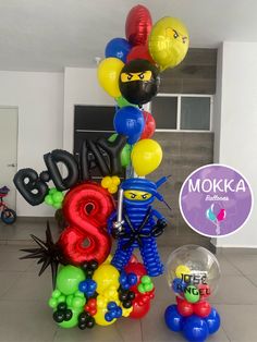 balloons are arranged in the shape of letters and characters for a birthday party or celebration