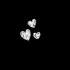 three white hearts on a black background