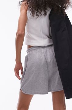 Level up your laid-back look in dolphin-hem sweat shorts, done with a neat drawstring and made from soft cotton fleece. 3 1/2" inseam; 27" leg opening; 13 1/2" front rise; 17" back rise (size Medium) Elastic/drawstring waist Side-seam pockets 100% cotton Machine wash, line dry Imported Sporty Stretch Shorts For Lounging, Sporty Pajama Shorts With Drawstring For Lounging, Sporty Drawstring Pajama Shorts For Lounging, Sporty Lounging Shorts, Casual Gray Shorts For Lounging, Stretch Drawstring Shorts For Lounging, Athleisure Sweatpants With Built-in Shorts, Loungewear Stretch Athletic Shorts With Drawstring, Stretch Athletic Shorts With Drawstring For Loungewear