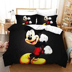 a mickey mouse bed set with two pillows