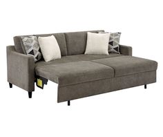 a gray couch with two pillows on it