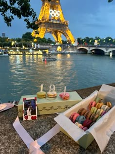 the eiffel tower in paris is lit up with lights and decorated pastries