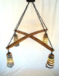 a chandelier with three bells hanging from it