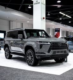 an suv is on display in a showroom