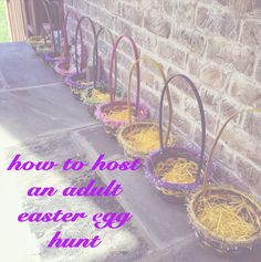 four baskets with yellow and purple straws in them on the side of a building