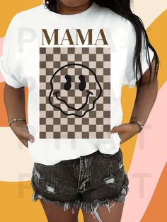 a woman wearing a t - shirt that says mama on it with a smiley face