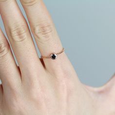 JSVConcepts Fine Jewelry Black Diamond Ring, Minimalist Ring, Black Diamond Solitaire Ring, Black Diamond Engagement Ring, Black Diamond Wedding Ring, 14k Gold Ring ≫ Product Details ◈ Stone and Size: Black Diamond (0.12 ct. ~ 0.13 ct) ◈ Stone Diameter: approximately 3.0mm ◈ Metal: 14K Solid Gold (18K also available - Additional fees may apply) ◈ Gold Color Options: White Gold, Rose Gold, Yellow Gold ≫ Please read our FAQ below for more detail. Black Round Band Fine Jewelry, Black Birthstone Ring Gift, Black Stackable Rings Fine Jewelry, Fine Jewelry Black Stackable Rings, Black Stackable Round Cut Rings, Black Stackable Fine Jewelry Rings, Black Spinel Rings For Promise, Gift Black Sapphire Ring With Black Diamonds, Black Sapphire Ring With Black Diamonds As Gift