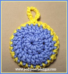 a crocheted blue and yellow round ornament