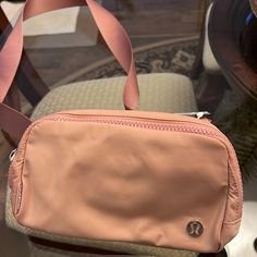 This Lululemon Belt Bag Is Light Pink And Still Has Tags. A Few Pictures Show More Of A Tan Color. Pink Fitness, Lululemon Belt Bag, Lululemon Pink, Pink Workout, Bag Brand, Tan Color, Waist Bag, Belt Bag, Picture Show