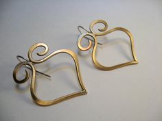 "Lovely swirls and lines make thise a simple yet elegant earring. Solid copper,bronze or sterling, All hand forged, shaped and finished. Size: Lg: H 2\" x W 1 5/8\" Md: H 1 3/4\" x W 1 1/4\" S: H 1 1/8\" x W 7/8\" * Each piece is individually shaped, pound so there will be very slight variations between each pair. *All copper and bronze has a food safe tough, clear protective coating which provides protection for metal from salt damage, tarnish, corrosion and oxidation. *Clean copper and bronze Elegant Hand Forged Swirl Earrings, Elegant Swirl Shaped Hand Forged Earrings, Clean Copper, Romantic Jewelry, Scroll Work, Swirl Earrings, Romantic Jewellery, Work Jewelry, Elegant Earrings