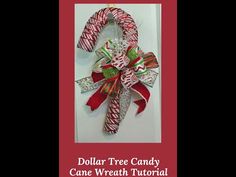 dollar tree candy cane wreath with red and green bows on it's front door