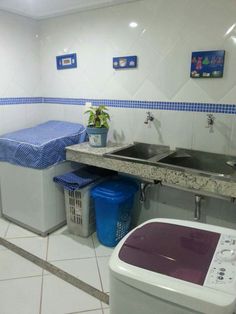 a laundry room with sink, washer and washing machine