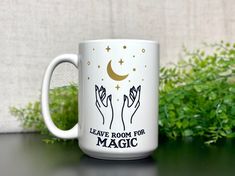 a white coffee mug with the words leave room for magic on it and two hands holding stars