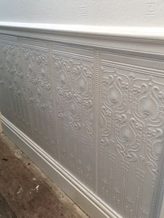 a white wall that has been painted with decorative paint