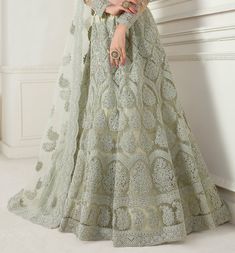 Dusty Mint Green Designer Heavy Embroidered Bridal Lehenga-Saira's Boutique Navratri Sets With Intricate Embroidery In Floor-length, Floor-length Sets With Intricate Embroidery For Navratri, Floor-length Embroidered Sets For Reception, Floor-length Sets With Intricate Embroidery For Diwali, Designer Long Sleeve Lehenga With Sheer Dupatta, Wedding Gown With Pallu In Pista Green, Wedding Gown In Pista Green With Pallu, Pista Green Wedding Gown With Pallu, Floor-length Pista Green Choli For Eid