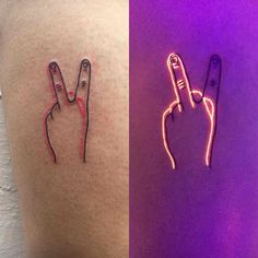 two different colored tattoos on the side of someone's thigh and one with a finger sign