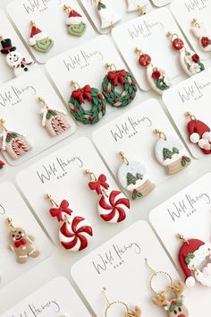 many christmas themed earrings are on display