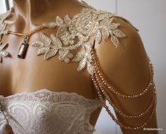 a mannequin is adorned with pearls and beads