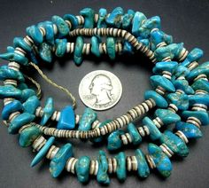 "OLD NAVAJO TURQUOISE and HEISHI NECKLACE DESCRIPTION: This venerable old necklace features tumbled turquoise beads and hand-rolled shell heishi. The strand is finished with a pair of coral beads. This extraordinary necklace will be a valuable addition to your collection of fine vintage Native American jewelry. MEASUREMENTS: Necklace measures 30\" long WEIGHT: 101.1 grams SIGNED: no" Traditional Turquoise Single Strand Necklace With Round Beads, Vintage Turquoise Gemstone Beads Jewelry, Vintage Turquoise Single Strand Necklace, Vintage Turquoise Necklace With Polished Beads, Collectible Turquoise Necklaces With Natural Stones, Vintage Turquoise Necklace With Polished Beads For Gift, Vintage Blue Hand-strung Beaded Necklaces, Turquoise Natural Stones Necklace For Collectors, Vintage Beaded Turquoise Necklace With Round Beads