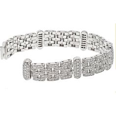 Savor the journey through the world of exquisite detailing and design in this breathtaking 18K White Gold 10.00 carat total weight Five Row Diamond Link Ladies Bracelet. Crafted with meticulous attention to detail, this bracelet is a masterpiece that exudes luxury and sophistication.Each of the five rows features dazzling round diamonds set in a secure link design, creating a harmonious flow of brilliance and elegance. The total carat weight of 10.00 carat total weight ensures a captivating sparkle that will mesmerize onlookers with every movement.The bracelet is approximately 20mm wide, making it a statement piece that commands attention and complements any outfit effortlessly. It is secured with a box clasp adorned with a safety feature, ensuring both style and peace of mind.Meticulously Luxury Platinum Bracelet With Pave Setting, Luxury Diamond Cut Bracelet, Luxury Diamond Cut Cuff Bracelet, Luxury Diamond Cut Bangle Bracelet, Luxury Diamond Bracelet With Pave Setting For Formal Occasions, Luxury Bangle Diamond Bracelet With Diamond Cut, Luxury Bracelets With Pave Setting For Formal Events, Luxury Bracelets With Pave Setting For Formal Occasions, Luxury Bracelets With Intricate Design