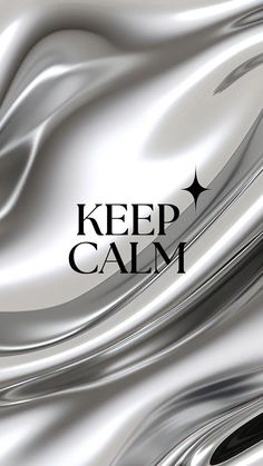 the words keep calm are displayed in black and white with silver swirls on it