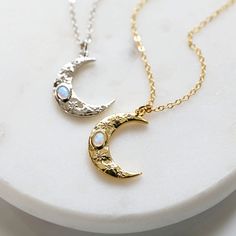 "Beautiful and lovely dainty moon necklace. Made of opal stone and CZ stone gold and silver color moon pendant with skinny gold plated and rhodium plated brass chain. Soft and simple. Great for gift, everyday or special occasion. Your item will ship in a gift box. Please feel free to contact me if you have any questions. ♥ Chain length 14\" - 20\" ♥ Moon pendant 5/8\" x 3/4\"  ♥ Gold plated over brass / Rhodium plated over brass /Opal stone  ♥ Creation Time: 1 - 3 days  ♥  See more Rudiana Accessories  Rudiana.etsy.com" Dainty Moon-shaped Birthstone Jewelry, Dainty Moon-shaped Birthstone Necklace, Dainty Moon Shaped Birthstone Necklace, Dainty Moonstone Necklaces In Moon Shape, Dainty Moonstone Moon Necklaces, Dainty Moonstone Moon Necklace, Moon-shaped Birthstone Necklace For Gifts, Moon Shaped Birthstone Necklace Gift, Moon Shaped Birthstone Necklace For Gift