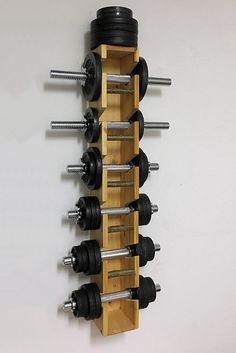 there is a wall mounted dumbbell rack on the wall