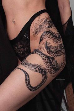 a woman with a dragon tattoo on her arm