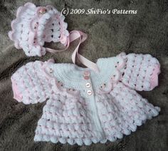 a crocheted baby sweater and hat set