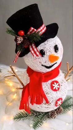 a snowman made out of string and yarn