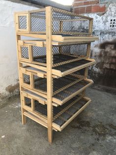 three tiered wooden shelf with wire mesh baskets