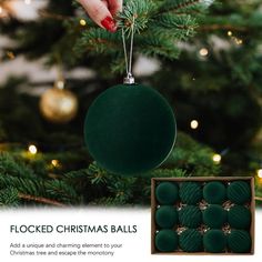 a christmas ornament with green balls hanging from it's side next to a tree