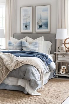 a bedroom with two pictures on the wall above the bed