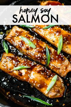 honey soy salmon in a skillet with sesame seeds