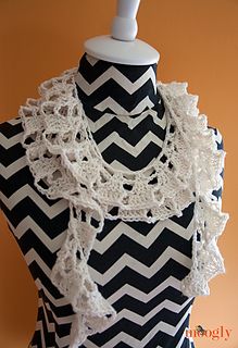 a black and white chevroned top with lacy trim