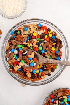 two bowls filled with nuts and candy